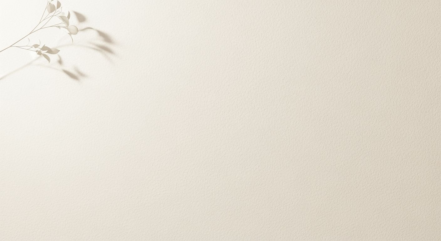 White wall with a plant on