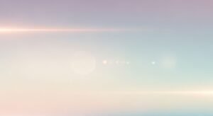 Blurry image of a sunset over the ocean Background Image