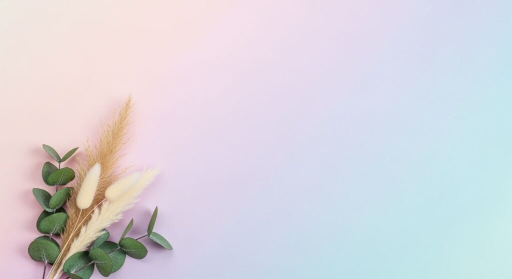 Bouquet of eucalyptus leaves and feathers on a pink and blue background Background Image