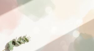 Branch of eucalyptus leaves on a white surface Background Image