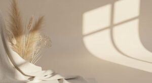 Bunch of wheat sitting on top of a table next to a window Background Image