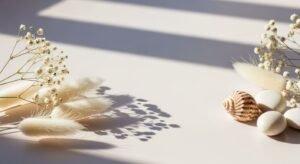 Bunch of white feathers and a shell on a table Background Image