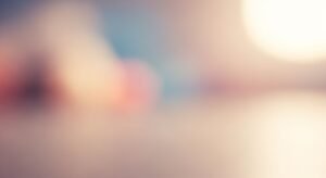 Close up of a blurry image of a person's face Background Image