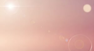 Pink background with circles and a sun in the background Background Image