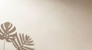 Shadow of a plant on a wall Background Image