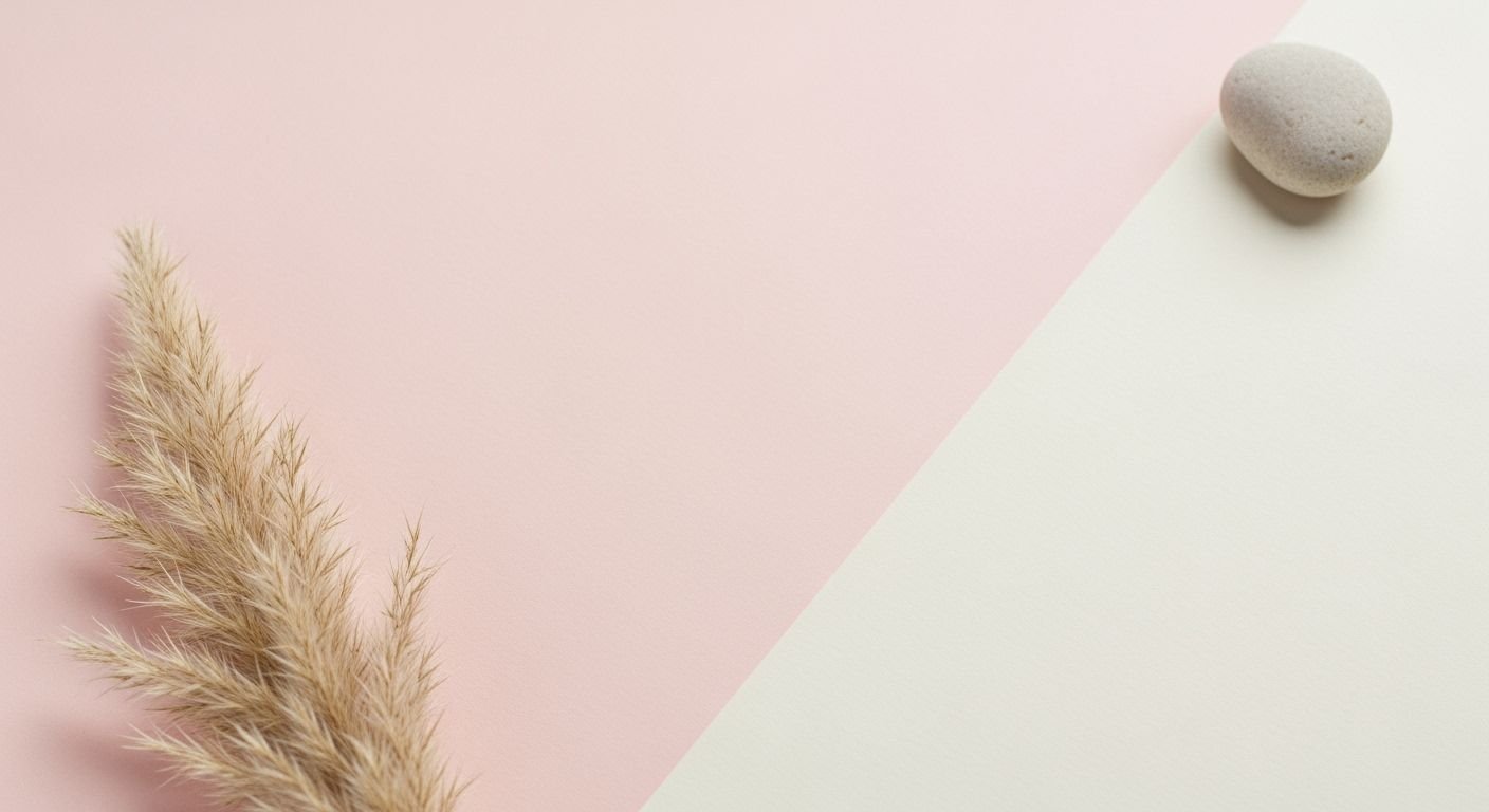 Stone and pampas grass on a pink and white background Background Image