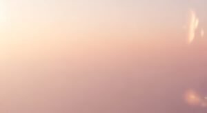 Sun is shining through the clouds in the sky Background Image