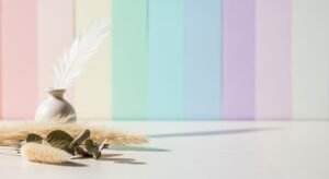 Vase with a feather on top of a table Background Image