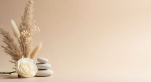 White rose sitting on top of a pile of rocks Background Image