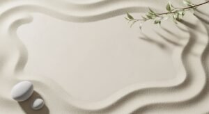 White stone sitting on top of a sandy beach next to a branch Background Image