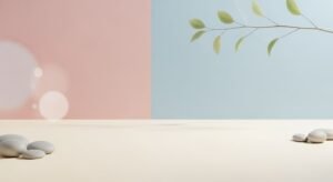 White table topped with pebbles next to a branch of a tree Background Image