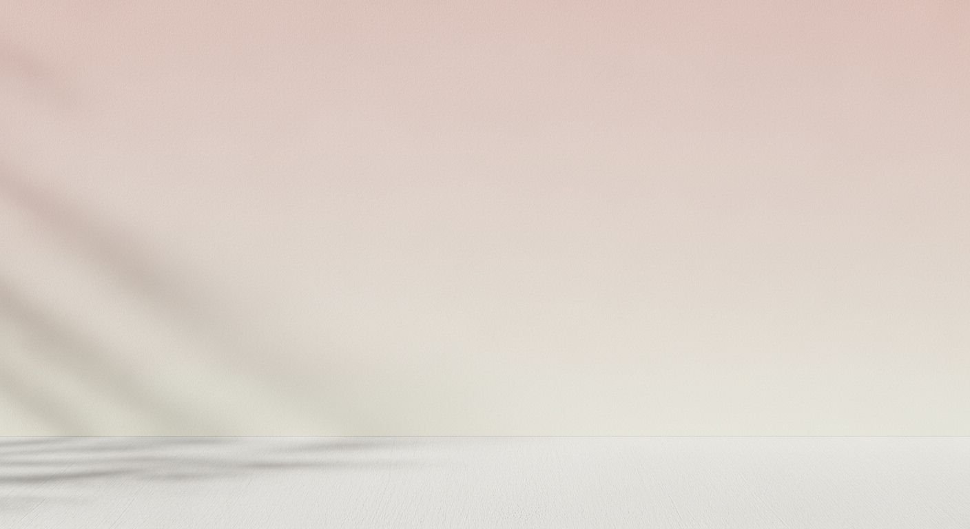White table with a pink wall in the background Background Image
