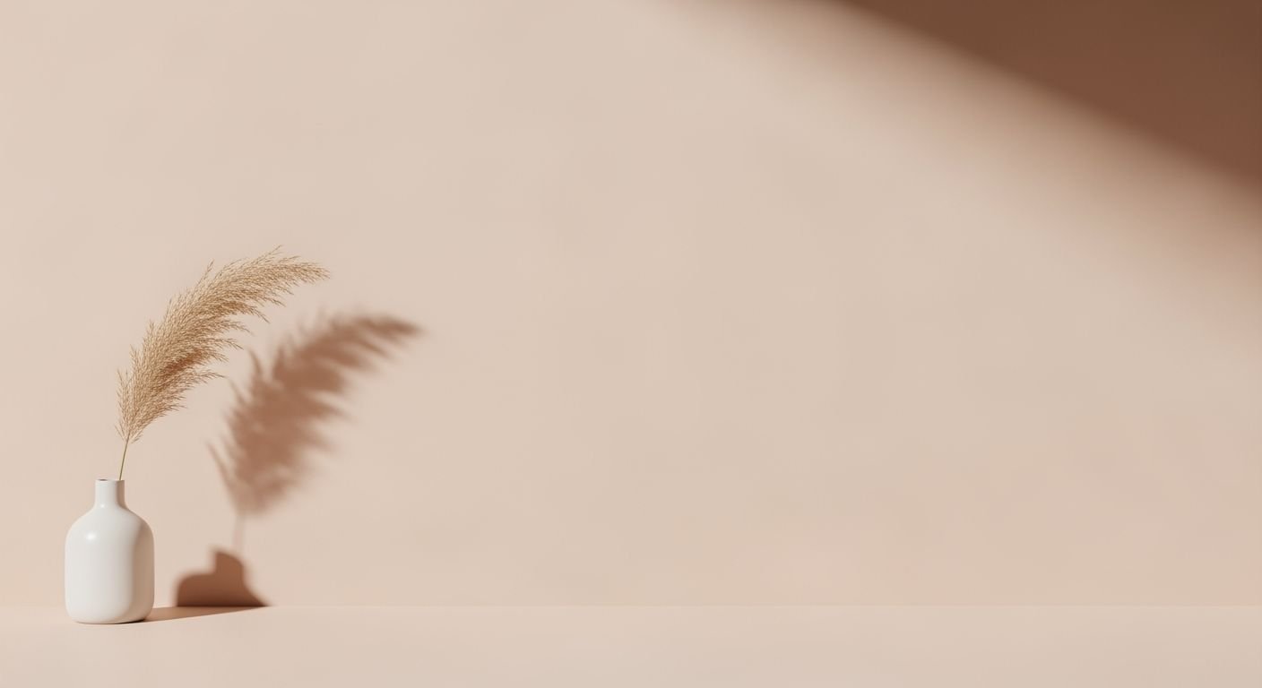 White vase sitting on top of a table next to a plant Background Image