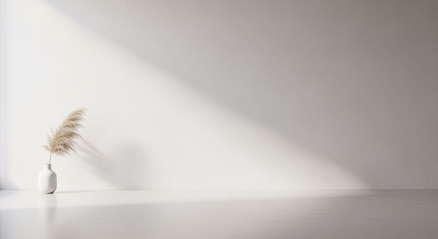 White vase with a plant in it sitting on a table Background Image