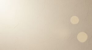 White wall with two circles painted on it Background Image